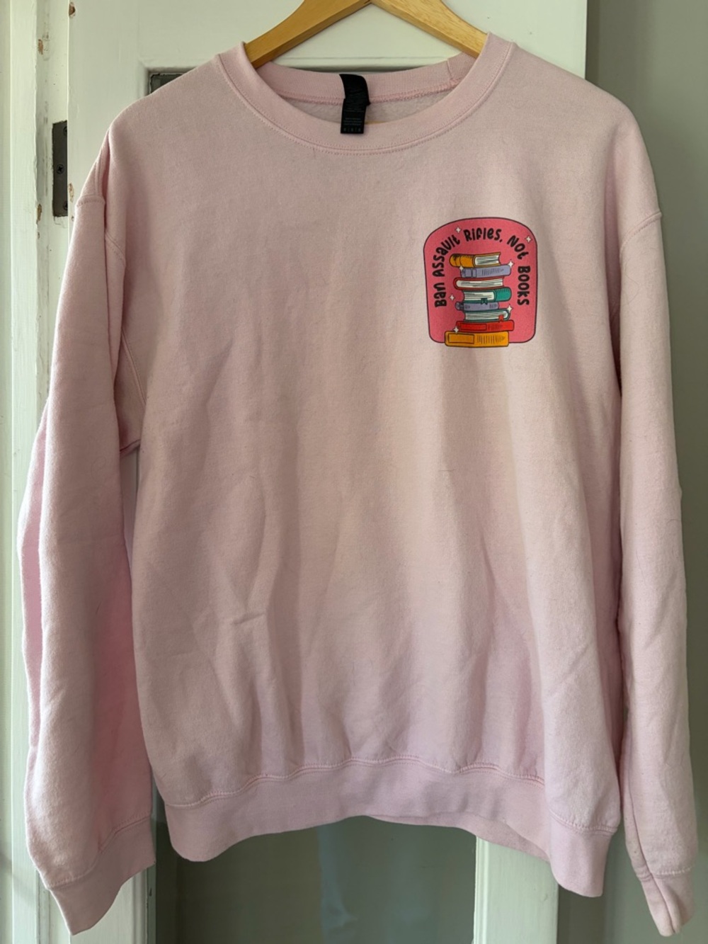 Social Goods Light Pink Crewneck Sweatshirt with Book Graphic